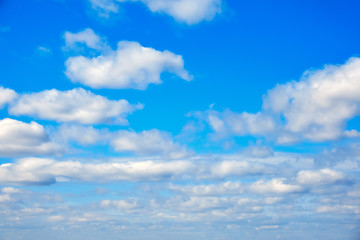 Naklejka na ściany i meble Big white clouds in the azure sky