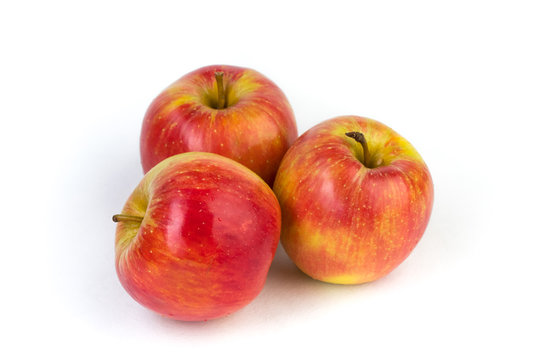 a juicy red apples on a white background.