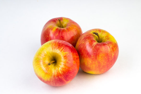 a juicy red apples on a white background.