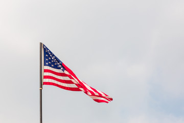 Abstract united states, American (USA) flag waving isolated on white background.