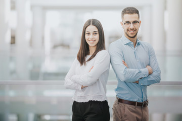 Two happy students waiting for their final exam at the university