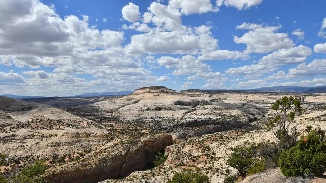 Time lapse of clouds moving, taken from atop the Escalante Grand Staircase National Monument. Camera panning right to left.