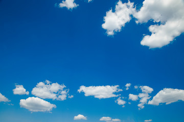 The sky is blue in white clouds. There is a place for inscriptions. Use for a background.