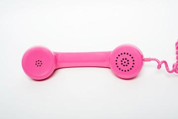 pink telephone on a white background