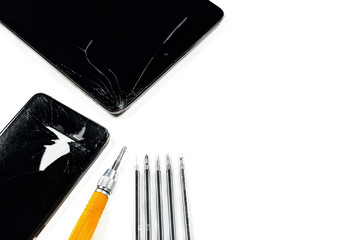 Smartphone repair concept. Broken tablet, mobile and repair tools