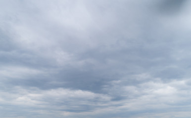Obraz premium Cloudy gray sky with thick dense clouds.