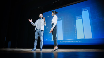 On Stage, Successful Female CEO and Male COO Speakers Present Company's New Product, Show...