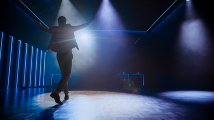 Famous Entertainer Gets on the Stage, Greets Audience, Starts Performance. Software Company...