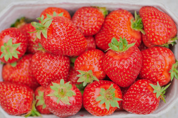 view from top on strawberries in a cardboard box