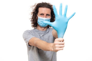 Emotional guy in medical mask and gloves. Pandemic coronavirus epidemic covid-19 quarantine...
