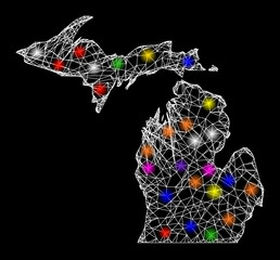 Web mesh vector map of Michigan State with glare effect on a black background. Abstract lines, light spots and circle dots form map of Michigan State constellation.
