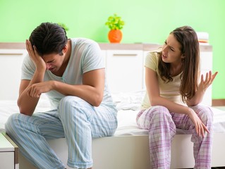 Woman and man in the bedroom during conflict