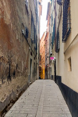 Fototapeta na wymiar Narrow alleys of the historical center of Savona, Liguria, Italy