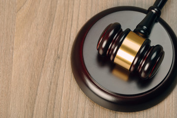 Symbol of law and justice on wooden table in lawyer office