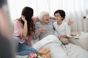 High-spirited woman laughing and gesticulating with her hands