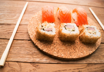 Set of sushi and maki roll on stone table. Top view with copy space