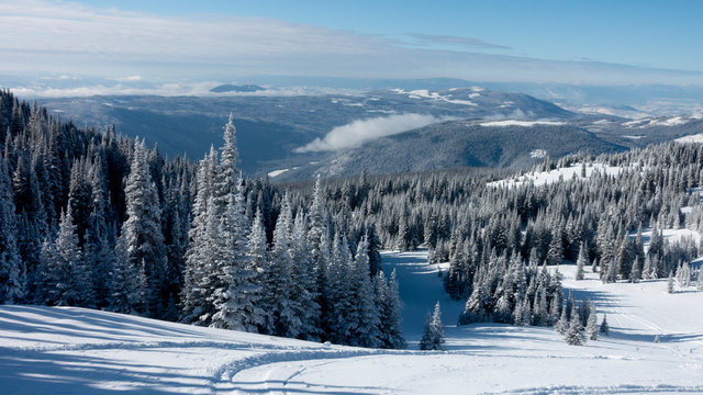 Scenic view of snow covered mountainside at ski resort, Sun Peaks Resort, Sun Peaks, British Columbia, Canada