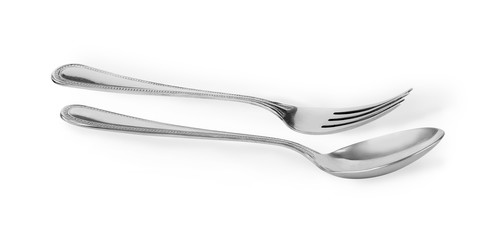 Steel spoon and fork isolated on white background.