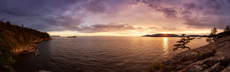 Beautiful Panoramic View of Howe Sound and Rocky Coast during a colorful dramatic sunset. Taken from Lighthouse Park, West Vancouver, British Columbia, Canada.
