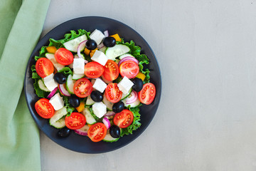 Green salad with tomato and fresh vegetables
