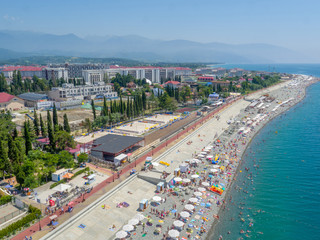 Fototapeta na wymiar Beach and promenade from above, buildings construction and hotels