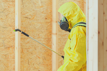 Worker in Safe Breathing Mask Disinfection Building Interior