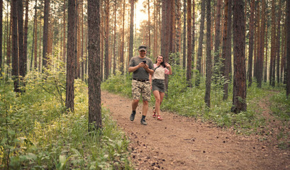 men using mobile phone in the forest	