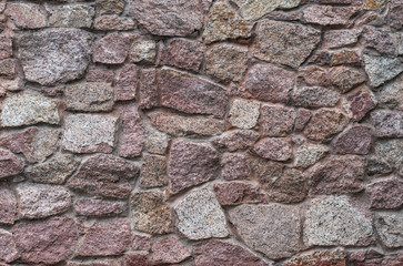 wall texture of multicolored masonry stones