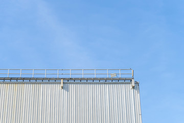 Some parts of the warehouse and blue sky background and copy space