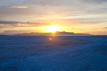 The golden shine of the the dusk sunlight off into the far distance of the wide open great salt lake. 