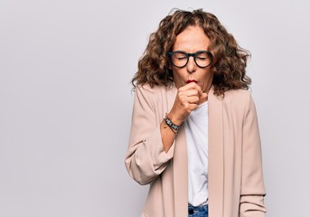 Middle age beautiful businesswoman wearing glasses standing over isolated white background feeling unwell and coughing as symptom for cold or bronchitis. Health care concept.