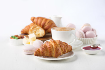Fresh delicious breakfast with coffee and  croissants