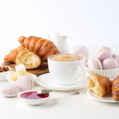 Fresh delicious breakfast with coffee and  croissants