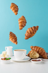 Fresh delicious breakfast with coffee and  croissants