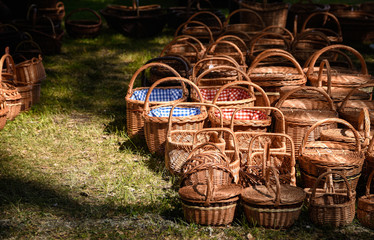 Handmade straw baskets on a lawn that are sold in the market in Sweden, old craftsmanship, old generation - 352631110