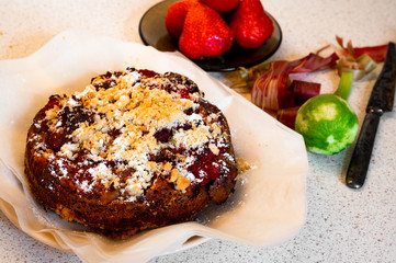 Baked strawberry and rhubarb cake, peels and strawberry.