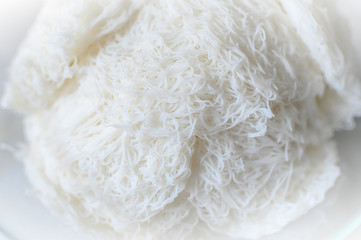 Idiyappam or string hoppers is a popular traditional breakfast cuisine of Kerala, South India. Rice flour pressed into white noodle form and then steamed.