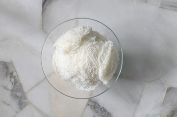 Idiyappam or string hoppers is a popular traditional breakfast cuisine of Kerala, South India. Rice flour pressed into white noodle form and then steamed.