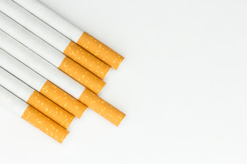 Stack of cigarettes on white background.
