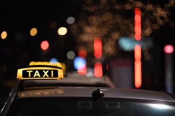 German taxi line up at station at night