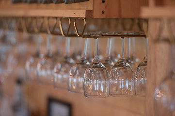 Glass goblets on a bar counter.