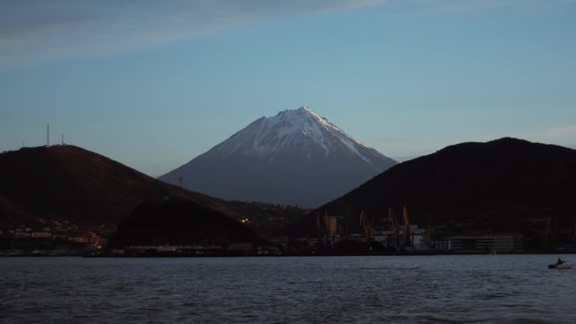 landscape of Klyuchevskaya Sopka volcano from Kamchatka, sea, mountains and port 