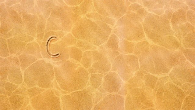 The inscription in the sand - COViD-19 Stay Alert.
