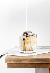Iced coffee with milk and ice.