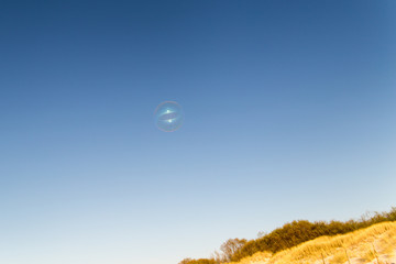 Fototapeta na wymiar soap bubbles in the sky