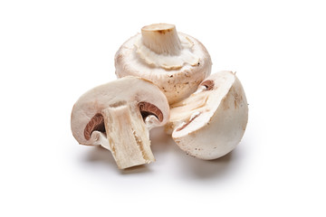 Fototapeta na wymiar White mushrooms lie on a white background