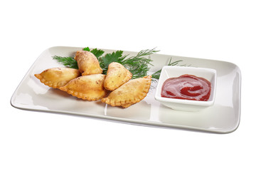 Chebureks on a white plate isolated on a white background