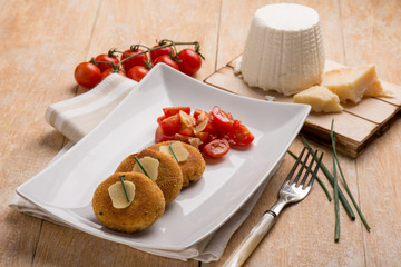 vegetarian ricotta cheese hamburger with tomatoes salad