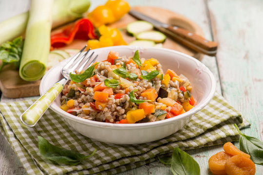 mixed spelt salad with mixed vegetables and dried apricot