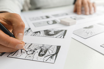 Artist illustrator draws a storyboard for the film. The animator creates sketches for the cartoon.